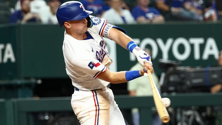 Texas Rangers third baseman Josh Jung (6) hits an rbi single against the Los Angeles Angels during the first inning at Globe Life Field. 