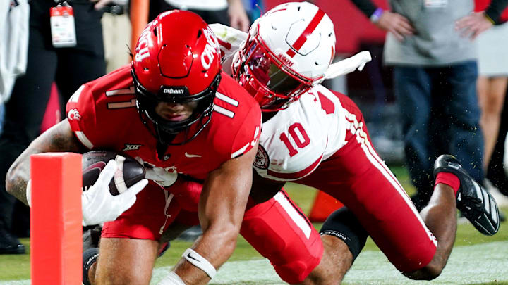 DUPLICATE***Cincinnati Bearcats tight end Joe Royer (11) catches a pass before being tackled by Nebraska Cornhuskers defensive back Andrew Marshall (10) in the fourth quarter of the Kansas City Classic season opening game between the Cincinnati Bearcats and Nebraska Cornhuskers, Aug. 28, 2025, at Arrowhead Stadium in Kansas City, Mo. Cornhuskers won 20-17.