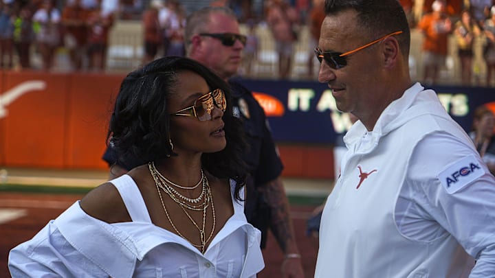 Texas Longhorns head coach Steve Sarkisian meets his wife Loreal Sarkisian after the 37-10 win over Rice at Royal-Memorial Stadium.