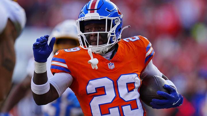 Jan 4, 2026; Denver, Colorado, USA; Denver Broncos cornerback Ja'quan McMillian (29) runs with the ball during the first half against the Los Angeles Chargers at Empower Field at Mile High. Mandatory Credit: Ron Chenoy-Imagn Images Jan 4, 2026; Denver, Colorado, USA; Denver Broncos cornerback Ja'quan McMillian (29) runs with the ball during the first half against the Los Angeles Chargers at Empower Field at Mile High. Mandatory Credit: Ron Chenoy-Imagn Images