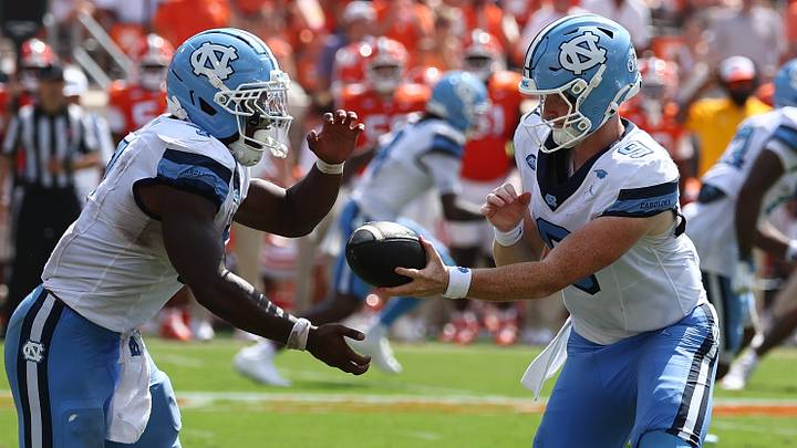 Sep 19, 2026; Clemson, South Carolina, USA; University of North Carolina Tar Heels quarterback Billy Edwards Jr. (9) hands the ball off to running back Benjamin Hall (7) during the third quarter against the Clemson Tigers Memorial Stadium. Mandatory Credit: Ashley Tumlin-Imagn Images Sep 19, 2026; Clemson, South Carolina, USA; University of North Carolina Tar Heels quarterback Billy Edwards Jr. (9) hands the ball off to running back Benjamin Hall (7) during the third quarter against the Clemson Tigers Memorial Stadium. Mandatory Credit: Ashley Tumlin-Imagn Images