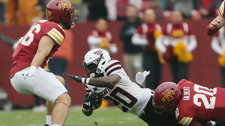 Iowa State Cyclones defensive back Khijohnn Cummings-Coleman (20) takes down Texas Tech Red Raiders' running back Cam'Ron Valdez (20) during the first quarter.