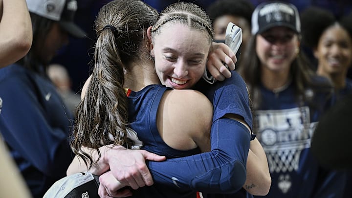 UConn Huskies guard Paige Bueckers celebrates with guard Nika Muhl after beating the USC Trojans in the 2024 NCAA Tournament.