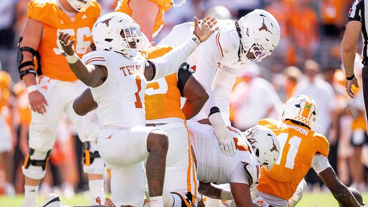 Texas edge Colin Simmons celebrates in a more appropriate manner after Tennessee quarterback Faizon Brandon is sacked during their game Saturday. Texas edge Colin Simmons celebrates in a more appropriate manner after Tennessee quarterback Faizon Brandon is sacked during their game Saturday.