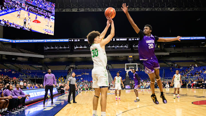 Wheatley forward Kam'Ron Hamiton leaps for a block on Kennedale's Jacks Stingley in the first half of the TX-4A Division II state championship. | Tom Dendy