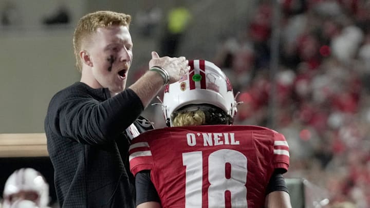 Injured Wisconsin quarterback Billy Edwards Jr. congratulates quarterback Danny O'Neil after a touchdown pass during the fourth quarter of their game Thursday, August 28, 2025 at Camp Randall Stadium in Madison, Wisconsin. Wisconsin beat Miami (Ohio) 17-0. Injured Wisconsin quarterback Billy Edwards Jr. congratulates quarterback Danny O'Neil after a touchdown pass during the fourth quarter of their game Thursday, August 28, 2025 at Camp Randall Stadium in Madison, Wisconsin. Wisconsin beat Miami (Ohio) 17-0.