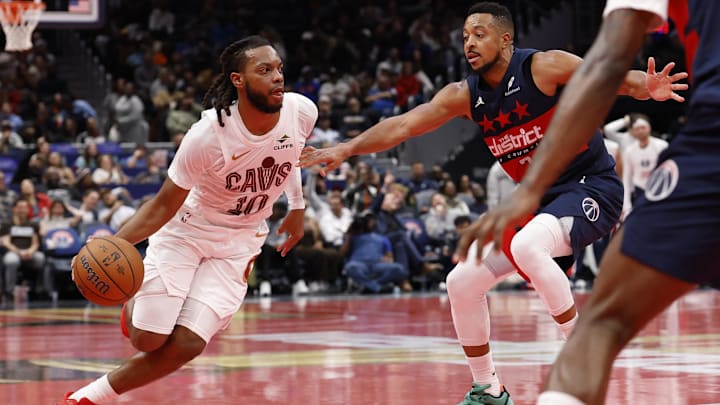 Nov 7, 2025; Washington, District of Columbia, USA; Cleveland Cavaliers guard Darius Garland (10) drives to the basket as Washington Wizards guard CJ McCollum (3) defends in the second half in an Emirates NBA Cup game at Capital One Arena. Mandatory Credit: Geoff Burke-Imagn Images