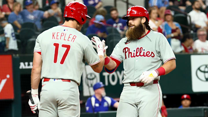 Aug 8, 2025; Arlington, Texas; Philadelphia Phillies center fielder Brandon Marsh (16) celebrates with Philadelphia Phillies left fielder Max Kepler (17) after hitting a home run during the fourth inning against the Texas Rangers at Globe Life Field. 