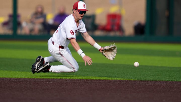 Oklahoma Sooners utility Cayden Brumbaugh (3) fields the ball in the first inning of a college baseball game between the University of Oklahoma (OU) and the Arizona State Sun Devils. Oklahoma Sooners utility Cayden Brumbaugh (3) fields the ball in the first inning of a college baseball game between the University of Oklahoma (OU) and the Arizona State Sun Devils.