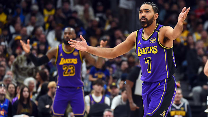 Los Angeles Lakers guard Gabe Vincent (7) and forward LeBron James (23) react after a foul call during the second half against the Denver Nuggets at Ball Arena.