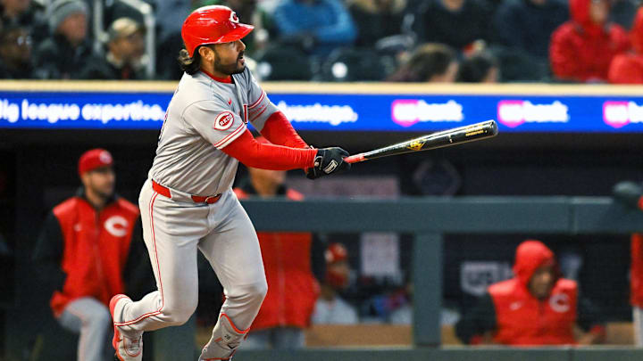 Apr 17, 2026; Minneapolis, Minnesota, USA; Cincinnati Reds third baseman Eugenio Suarez (28) hits a double in the fourth inning against the Minnesota Twins at Target Field. Mandatory Credit: Nick Wosika-Imagn Images