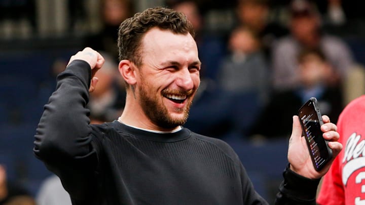 Former Texas A&M Heisman Trophy-winning quarterback Johnny Manziel cheers on the Aggies during the first round game between Texas A&M and Nebraska in the 2024 NCAA Tournament at FedExForum in Memphis, Tenn., on Friday, March 22, 2024.