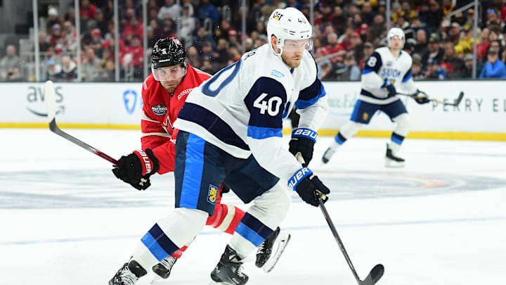 Feb 17, 2025; Boston, MA, USA; [Imagn Images direct customers only]  Team Finland forward Joel Armia (40) skates with the puck past Team Canada defenseman Devon Toews (5) during the second period in a 4 Nations Face-Off ice hockey game at TD Garden. Mandatory Credit: Bob DeChiara-Imagn Images
