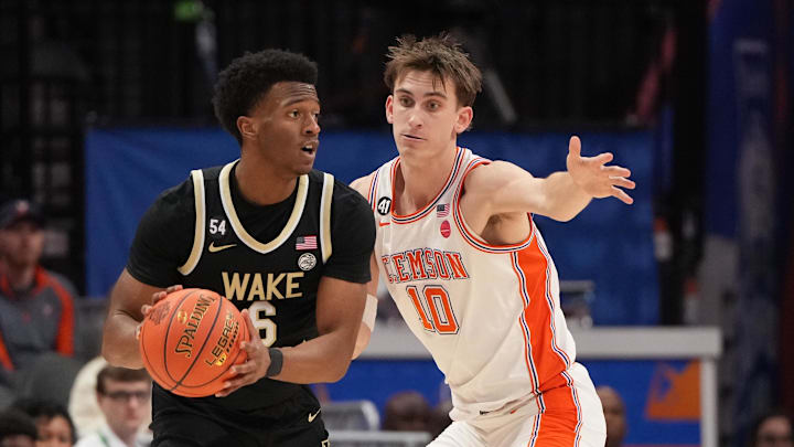 Mar 11, 2026; Charlotte, NC, USA; Wake Forest Demon Deacons guard Myles Colvin (6) with the ball as Clemson Tigers forward Jake Wahlin (10) defends in the second half at Spectrum Center. Mandatory Credit: Bob Donnan-Imagn Images