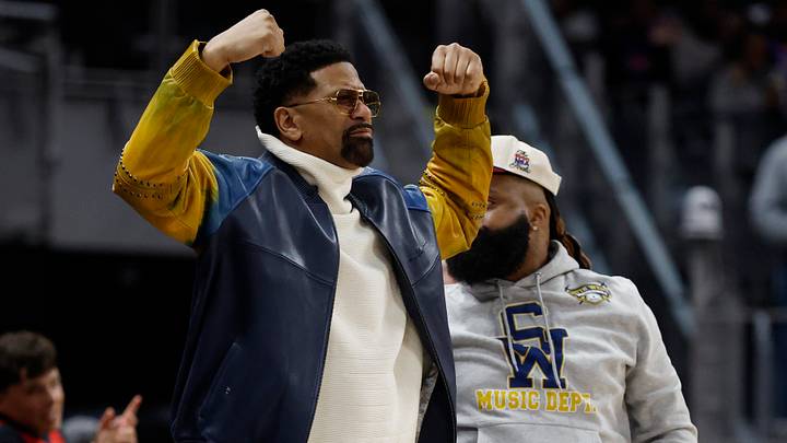 Feb 23, 2026; Detroit, Michigan, USA;  Former NBA Player Jalen Rose celebrates in the first half of the game between the Detroit Pistons and the San Antonio Spurs at Little Caesars Arena. Mandatory Credit: Rick Osentoski-Imagn Images