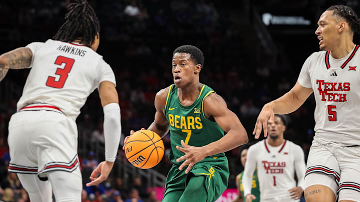 Mar 13, 2025; Kansas City, MO, USA; Baylor Bears guard VJ Edgecombe (7) drives to the basket around Texas Tech Red Raiders guard Elijah Hawkins (3) during the second half at T-Mobile Center. Mandatory Credit: William Purnell-Imagn Images