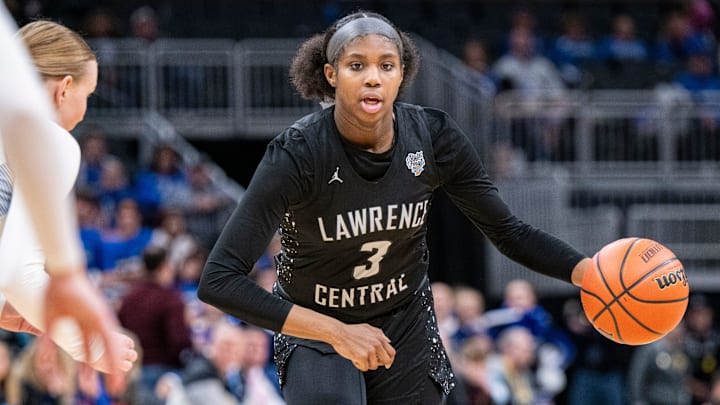Lawrence Central High School sophomore Lola Lampley (3) drives toward the basket during the second half of an IHSAA class 4A girls    basketball state finals game against Lake Central high School, Saturday, Feb. 24, 2024, at Gainbridge Fieldhouse, in Indianapolis. Lawrence Central won the school   s first state championship title in girl   s basketball.