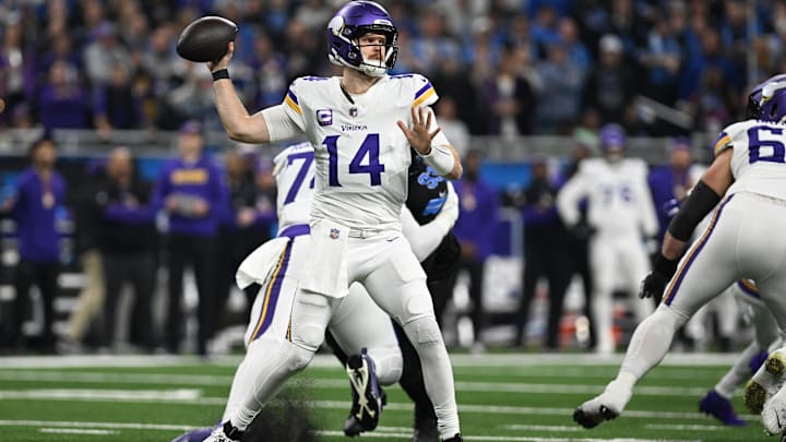 Minnesota Vikings quarterback Sam Darnold (14) throws against the Detroit Lions