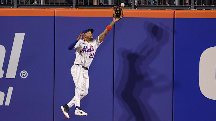 Apr 29, 2025; New York City, New York, USA; New York Mets left fielder Jose Azocar (28) leaps but can not catch a ball hit by Arizona Diamondbacks third baseman Eugenio Suarez (not pictured) during the eighth inning at Citi Field. Mandatory Credit: Vincent Carchietta-Imagn Images Apr 29, 2025; New York City, New York, USA; New York Mets left fielder Jose Azocar (28) leaps but can not catch a ball hit by Arizona Diamondbacks third baseman Eugenio Suarez (not pictured) during the eighth inning at Citi Field. Mandatory Credit: Vincent Carchietta-Imagn Images