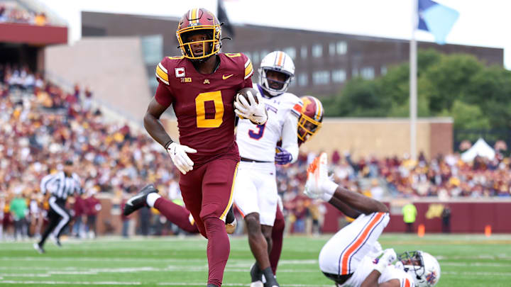 Sep 6, 2025; Minneapolis, Minnesota, USA; Minnesota Golden Gophers wide receiver Le'Meke Brockington (0) runs the ball for a touchdown against the Northwestern State Demons during the first quarter at Huntington Bank Stadium. Mandatory Credit: Matt Krohn-Imagn Images