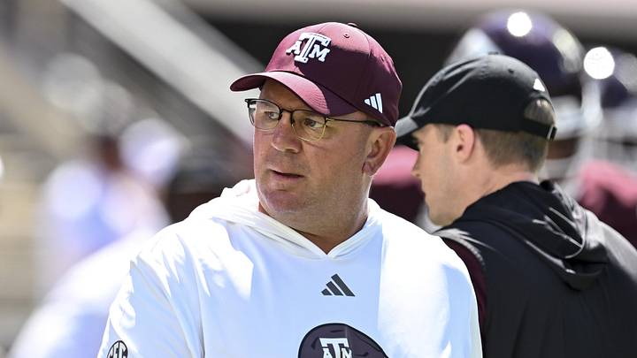 Texas A&M Aggies head coach Mike Elko walks on the field prior to the game against the Auburn Tigers at Kyle Field. 