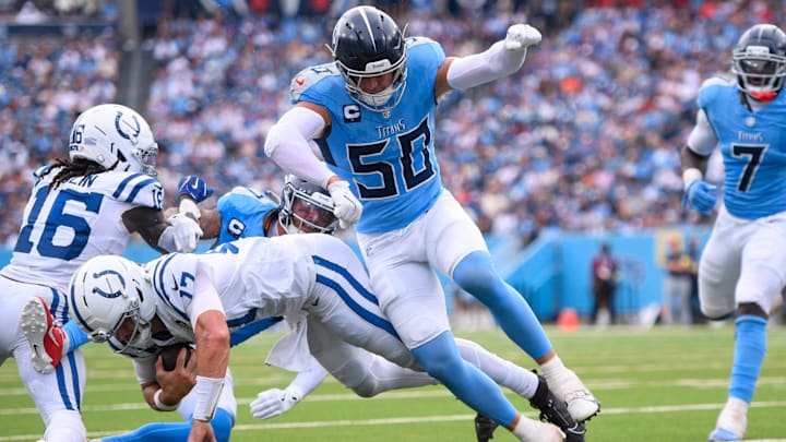 Tennessee Titans linebacker Cody Barton tackles Indianapolis Colts quarterback Daniel Jones just short of the goal line.