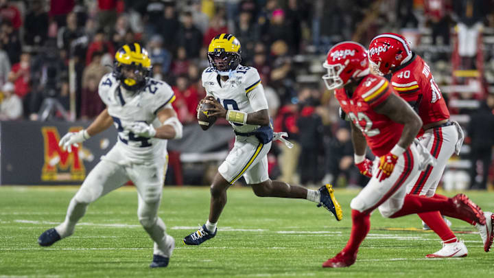 Nov 22, 2025; College Park, Maryland, USA; Michigan Wolverines quarterback Bryce Underwood (19) rolls out to pass during the second half against the Maryland Terrapins at SECU Stadium. Mandatory Credit: Tommy Gilligan-Imagn Images Nov 22, 2025; College Park, Maryland, USA; Michigan Wolverines quarterback Bryce Underwood (19) rolls out to pass during the second half against the Maryland Terrapins at SECU Stadium. Mandatory Credit: Tommy Gilligan-Imagn Images