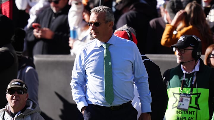 Nov 16, 2024; Boulder, Colorado, USA; Fox Sports reporter Urban Meyer walks the sidelines in the first quarter between the Utah Utes against the Colorado Buffaloes at Folsom Field.