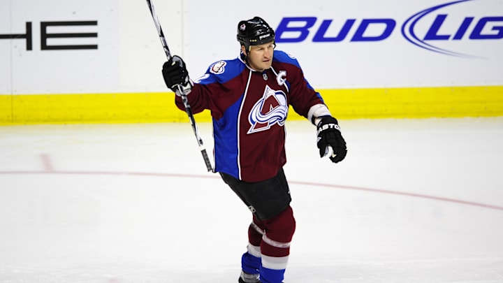Colorado Avalanche defenseman Adam Foote reacts after center Ryan O'Reilly scored a goal.