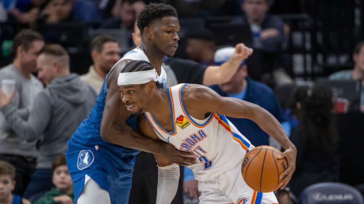 Oklahoma City Thunder guard Shai Gilgeous-Alexander dribbles the ball past Minnesota Timberwolves guard Anthony Edwards in the second half at Target Center in Minneapolis on Jan. 20, 2024. Oklahoma City Thunder guard Shai Gilgeous-Alexander dribbles the ball past Minnesota Timberwolves guard Anthony Edwards in the second half at Target Center in Minneapolis on Jan. 20, 2024.