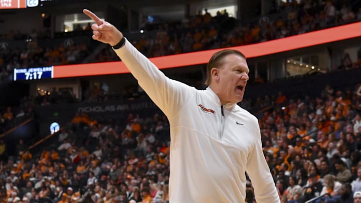 Dec 6, 2025; Nashville, Tennessee, USA;  Illinois Fighting Illini head coach Brad Underwood yells to his bench against the Tennessee Volunteers during the first half at Bridgestone Arena. Mandatory Credit: Steve Roberts-Imagn Images