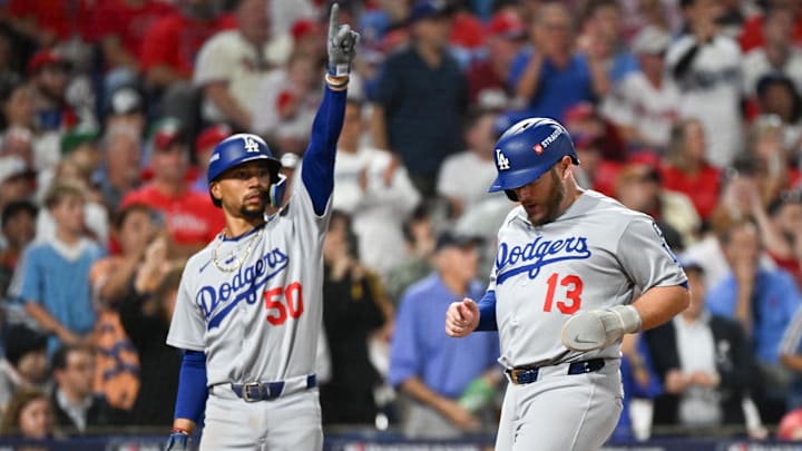 Oct 6, 2025; Philadelphia, Pennsylvania, USA; Los Angeles Dodgers third baseman Max Muncy (13) scores a run against the Philadelphia Phillies as teammate Mookie Betts (50) celebrates in the seventh inning during game two of the NLDS round for the 2025 MLB playoffs at Citizens Bank Park. Mandatory Credit: Eric Hartline-Imagn Images Oct 6, 2025; Philadelphia, Pennsylvania, USA; Los Angeles Dodgers third baseman Max Muncy (13) scores a run against the Philadelphia Phillies as teammate Mookie Betts (50) celebrates in the seventh inning during game two of the NLDS round for the 2025 MLB playoffs at Citizens Bank Park. Mandatory Credit: Eric Hartline-Imagn Images