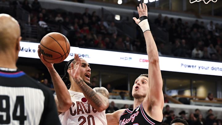 Dec 17, 2025; Chicago, Illinois, USA; Cleveland Cavaliers guard Jaylon Tyson (20) passes away from Chicago Bulls forward Zach Collins (12) during the first half at United Center. Mandatory Credit: Matt Marton-Imagn Images Dec 17, 2025; Chicago, Illinois, USA; Cleveland Cavaliers guard Jaylon Tyson (20) passes away from Chicago Bulls forward Zach Collins (12) during the first half at United Center. Mandatory Credit: Matt Marton-Imagn Images