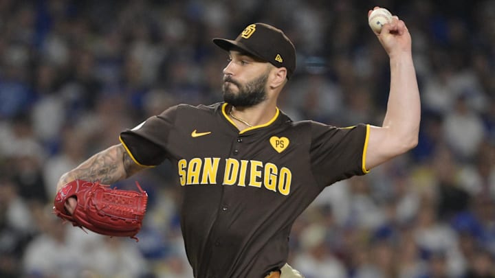 Oct 6, 2024; Los Angeles, California, USA; San Diego Padres pitcher Tanner Scott (66) pitches against the Los Angeles Dodgers in the eighth inning during game two of the NLDS for the 2024 MLB Playoffs at Dodger Stadium Oct 6, 2024; Los Angeles, California, USA; San Diego Padres pitcher Tanner Scott (66) pitches against the Los Angeles Dodgers in the eighth inning during game two of the NLDS for the 2024 MLB Playoffs at Dodger Stadium