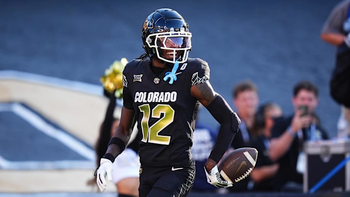 Aug 29, 2024; Boulder, Colorado, USA; Colorado Buffaloes wide receiver Travis Hunter (12) reacts after scoring a touchdown in the first half against the North Dakota State Bison at Folsom Field. Mandatory Credit: Ron Chenoy-USA TODAY Sports