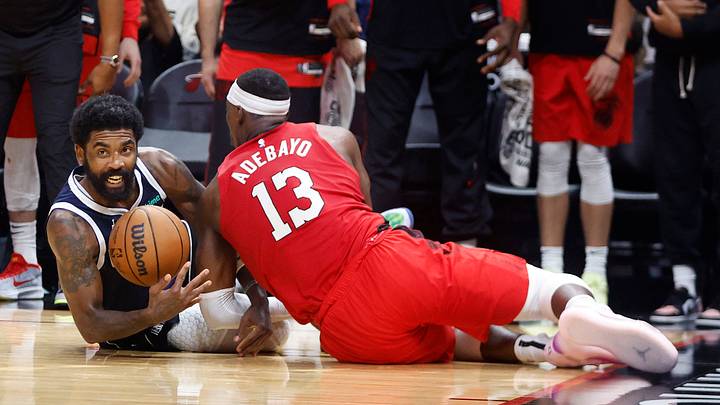 Nov 24, 2024; Miami, Florida, USA; Dallas Mavericks guard Kyrie Irving (11) and Miami Heat center Bam Adebayo (13) fight for a loose ball during the second half at Kaseya Center. Mandatory Credit: Rhona Wise-Imagn Images Nov 24, 2024; Miami, Florida, USA; Dallas Mavericks guard Kyrie Irving (11) and Miami Heat center Bam Adebayo (13) fight for a loose ball during the second half at Kaseya Center. Mandatory Credit: Rhona Wise-Imagn Images