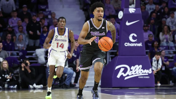Jan 24, 2026; Manhattan, Kansas, USA; Kansas State Wildcats guard P.J. Haggerty (4) brings the ball up court during the first half against the Kansas Jayhawks at Bramlage Coliseum. Mandatory Credit: Scott Sewell-Imagn Images
