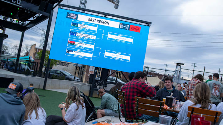A small crowd gathers during an NCAA Selection Sunday watch party in Knoxville, Tenn., in 2024.