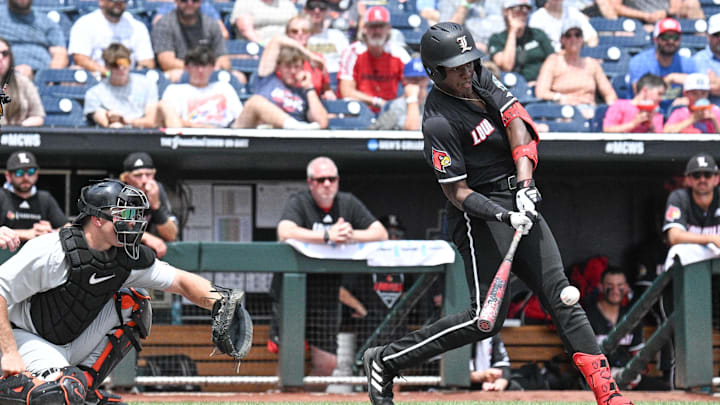Jun 17, 2025; Omaha, Neb, USA;  Louisville Cardinals right fielder Eddie King Jr. (42) drives in a run with a base hit against the Oregon State Beavers during the first inning at Charles Schwab Field. Mandatory Credit: Steven Branscombe-Imagn Images