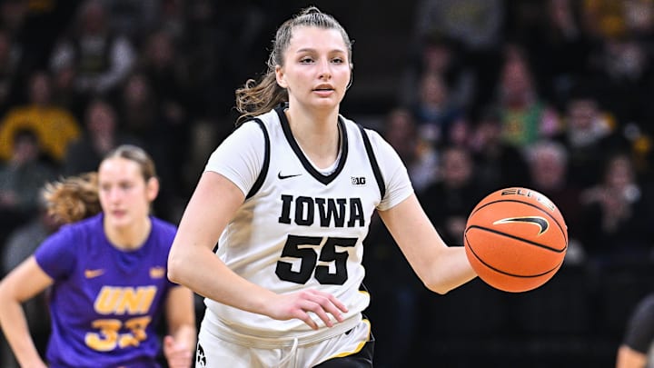 Dec 20, 2024; Iowa City, Iowa, USA; Iowa Hawkeyes guard Teagan Mallegni (55) controls the ball against the Northern Iowa Panthers during the first quarter at Carver-Hawkeye Arena. Mandatory Credit: Jeffrey Becker-Imagn Images