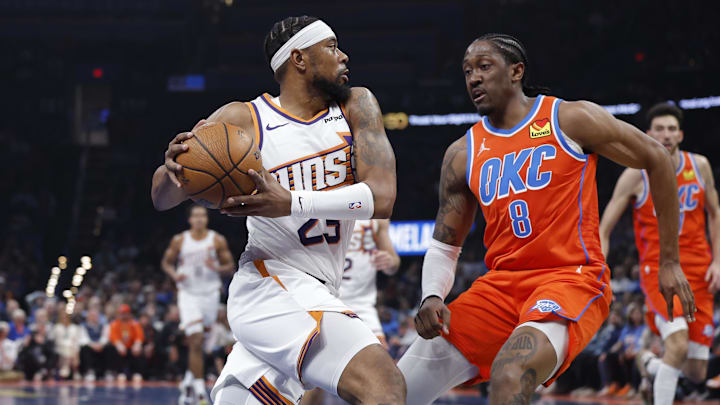 Dec 10, 2025; Oklahoma City, Oklahoma, USA; Phoenix Suns guard Jordan Goodwin (23) drives to the basket against Oklahoma City Thunder guard Jalen Williams (8) during the second quarter at Paycom Center. Dec 10, 2025; Oklahoma City, Oklahoma, USA; Phoenix Suns guard Jordan Goodwin (23) drives to the basket against Oklahoma City Thunder guard Jalen Williams (8) during the second quarter at Paycom Center.