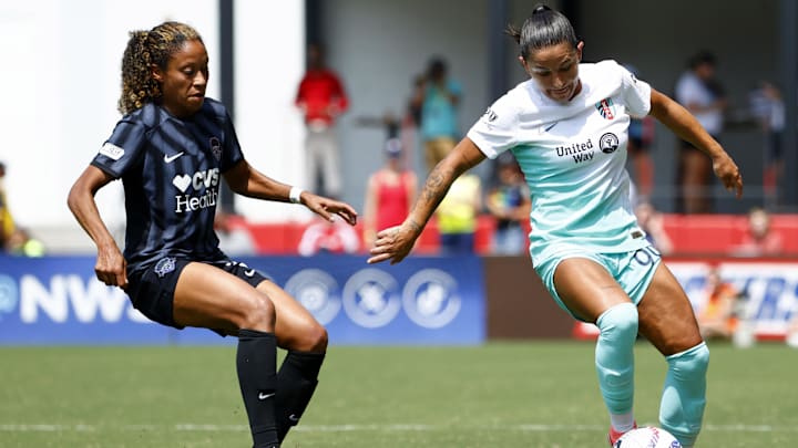 Kansas City Current midfielder Debinha (99) controls the ball against Washington Spirit defender Casey Krueger (3)