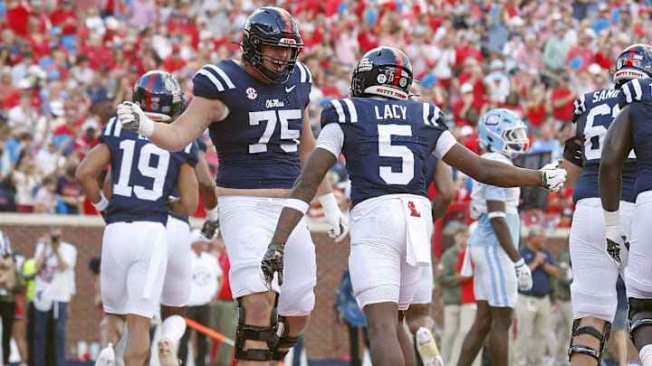 Nov 8, 2025; Oxford, Mississippi, USA; Mississippi Rebels offensive lineman Patrick Kutas (75) reacts with running back Kewan Lacy (5) after a touchdown during the first quarter against The Citadel Bulldogs at Vaught-Hemingway Stadium. Mandatory Credit: Petre Thomas-Imagn Images