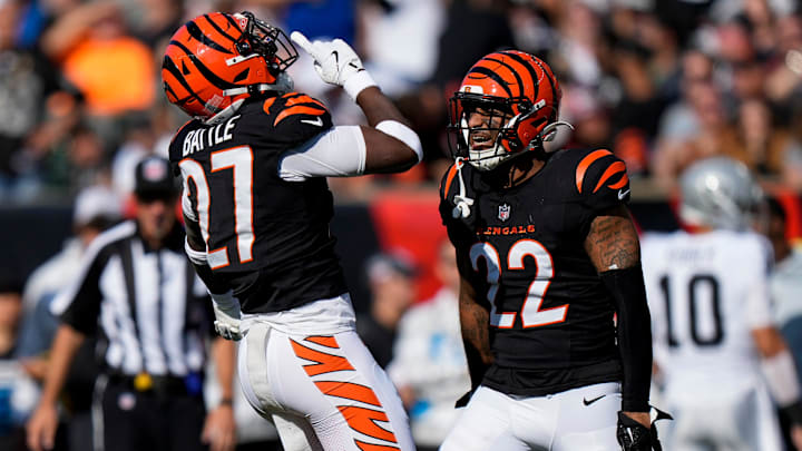 Cincinnati Bengals safety Jordan Battle (27) and safety Geno Stone (22) celebrate a stop in the second quarter of the NFL Week 9 game between the Cincinnati Bengals and the Las Vegas Raiders at Paycor Stadium in downtown Cincinnati on Sunday, Nov. 3, 2024.