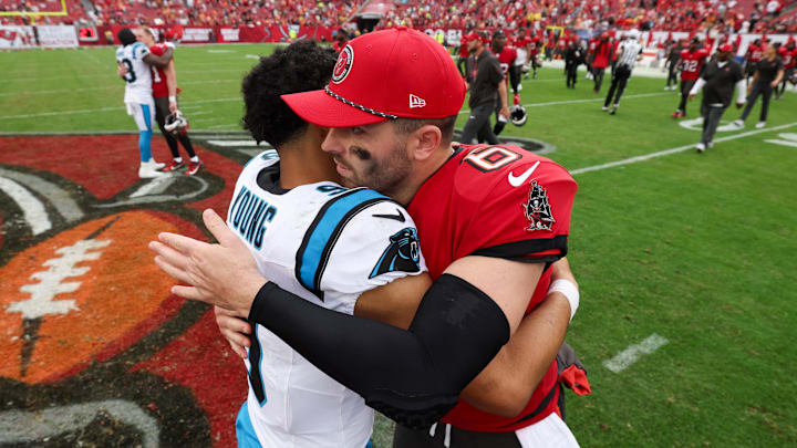 Dec 29, 2024; Tampa, Florida, USA; Tampa Bay Buccaneers quarterback Baker Mayfield (6) great Carolina Panthers quarterback Bryce Young (9) after a game at Raymond James Stadium. Mandatory Credit: Nathan Ray Seebeck-Imagn Images