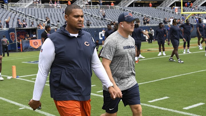 Aug 26, 2023; Chicago, Illinois, USA;  Chicago Bears General Manager Ryan Poles, left, and Luke Getsy, Offensive Coordinator walk the field  before the team s game against the Buffalo Bills at Soldier Field. Mandatory Credit: Matt Marton-Imagn Images