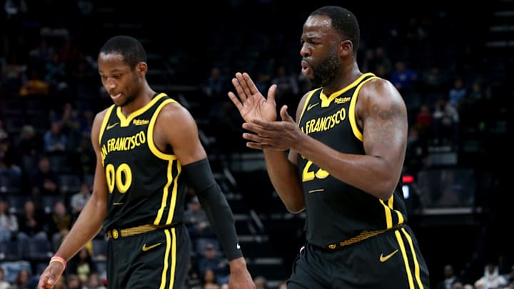 Jan 15, 2024; Memphis, Tennessee, USA; Golden State Warriors forward Jonathan Kuminga (00) and Golden State Warriors forward Draymond Green (23) walk to the bench at the end of the first quarter against the Memphis Grizzlies  at FedExForum. Mandatory Credit: Petre Thomas-Imagn Images