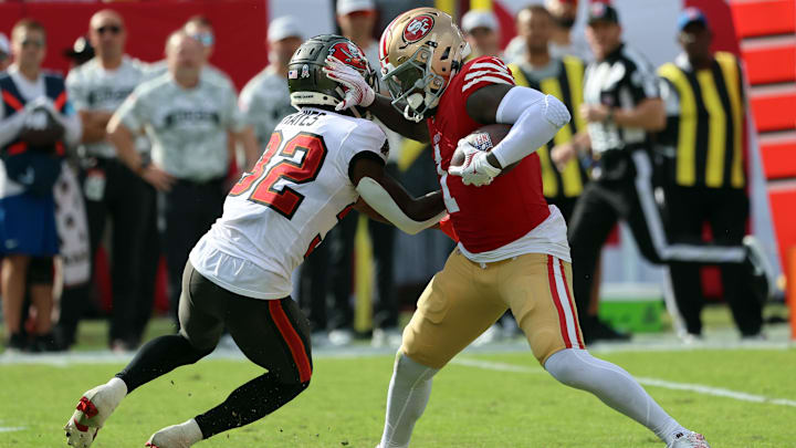 Nov 10, 2024; Tampa, Florida, USA; San Francisco 49ers wide receiver Deebo Samuel Sr. (1) stiff arms Tampa Bay Buccaneers safety Josh Hayes (32) during the second half at Raymond James Stadium. Mandatory Credit: Kim Klement Neitzel-Imagn Images