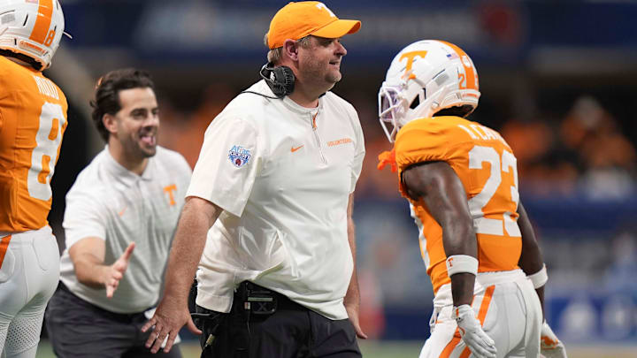 Tennessee head coach Josh Heupel celebrates on the sideline with defensive back Boo Carter (23) during the Aflac Kickoff Game between the Volunteers and Syracuse held at Mercedes-Benz Stadium in Atlanta, Ga., on August 30, 2025.