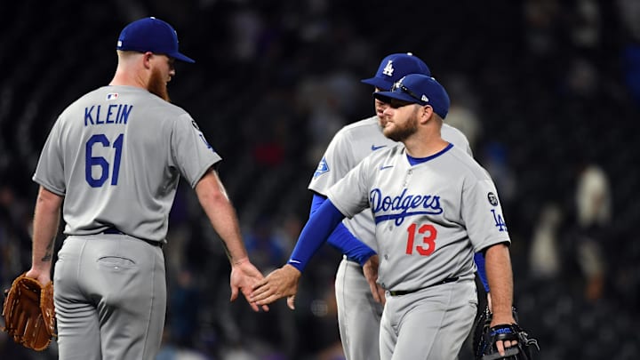 Jun 25, 2025; Denver, Colorado, USA; Los Angeles Dodgers pitcher Will Klein (61) and third base Max Muncy (13) celebrate after a win against the Colorado Rockies at Coors Field. Mandatory Credit: Christopher Hanewinckel-Imagn Images
